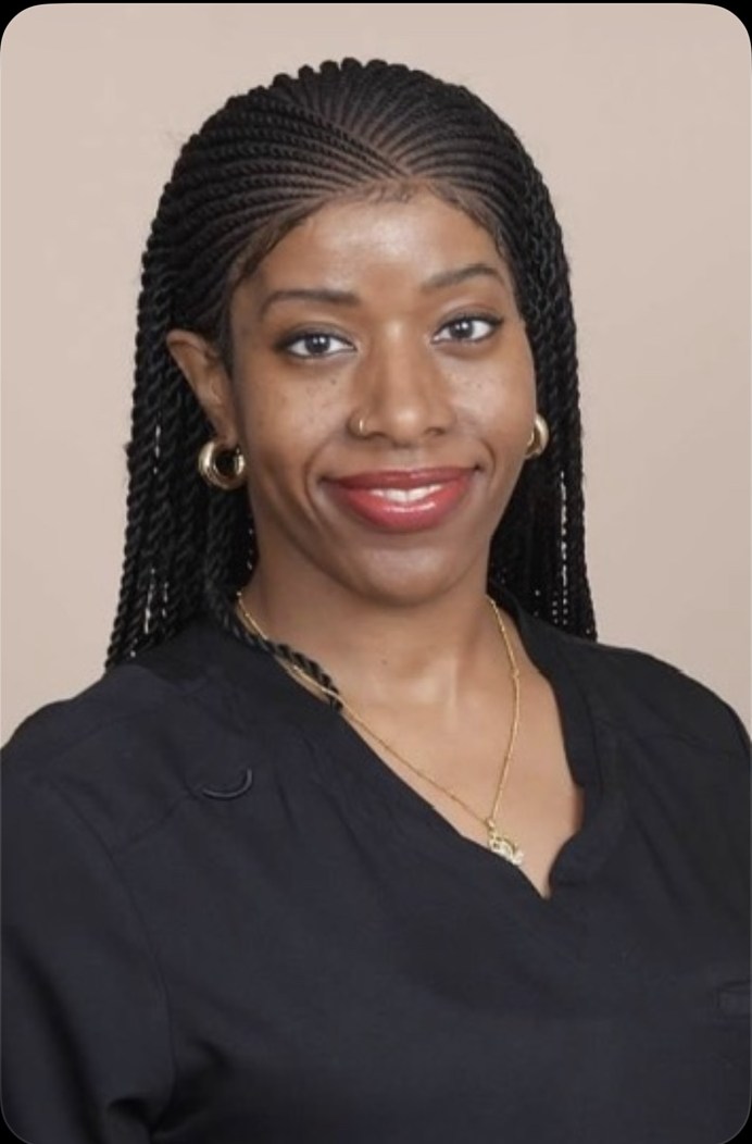 Ursula in black professional attire, founder of Noir Luxe